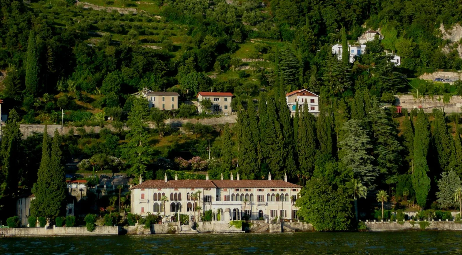 Villa Monastero seen from Lake Como, its long arcaded front below the terraced hillside